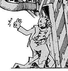 vash crouched down and making an OK symbol with his hand